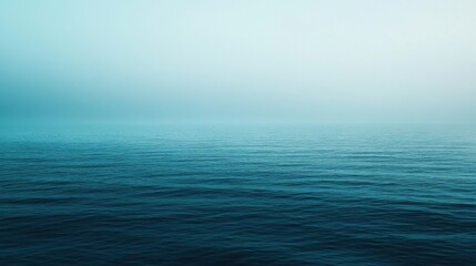 Wall Mural - The image is of a calm, blue ocean with no visible waves