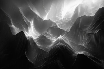 A black and white photo of mountains with a white and gray sky