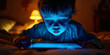 © MNStudio - Cute little child looking at their tablet in dark living room. Kid playing computer games before bed.