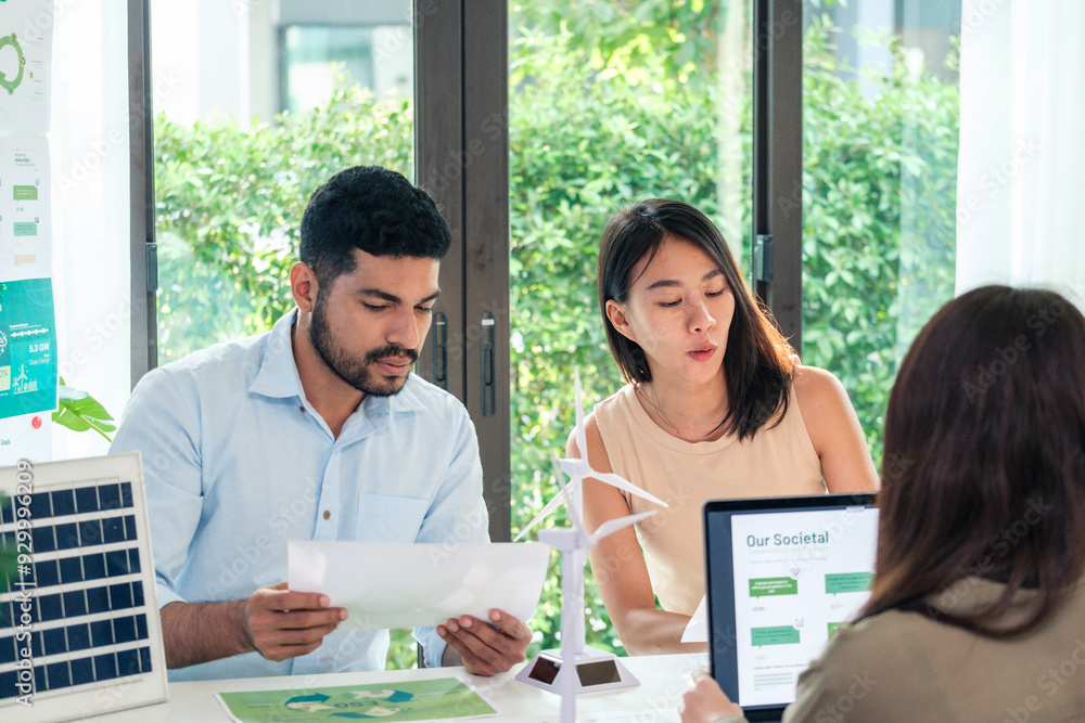 diversity team brainstorming discussion focused on ESG (environment,social,governance) for sdgs goals in a sustainable green office