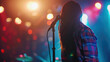 © sommersby - A performer captures the audience’s attention with their back to the crowd while colorful lights illuminate the stage