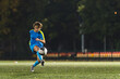 © PoppyPix - Soccer girl playing game as a goalie. Youth female football team playing tournament match. High quality photo