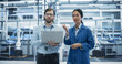 © Gorodenkoff - Caucasian Man and Asian Female Having a Conversation at Industrial Facility. Advanced Factory Employees Working Together, Using Laptop Computer for Supervising Work Process in a Modern Facility