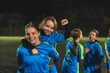© PoppyPix - cute little girls with soccer uniforms taking photos before practice in the evening, football stadium. High quality photo