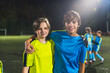 © PoppyPix - school girls football team players posing together in a stadium before practice, medium shot. High quality photo
