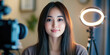 © dinastya - Asian young beautiful woman blogging in front of a ring lamp. Beauty blogger, Influencer, working from home