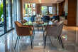 © Maya Crafta - Modern Dining Room Interior Design with Glass Table and Beige Chairs - Photo