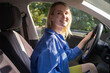 © leriostereo - Young woman is driving a car. Car travel, lifestyle concept