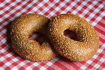 Wall Mural - turkish bagels or simit on checkered table cloth