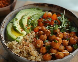 Wall Mural - Beautifully Arranged Buddha Bowl with Quinoa Avocado Roasted Chickpeas and Mixed Vegetables