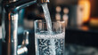 © Cavad - Close-up of water being poured from a tap into a glass. Represents drinking water.