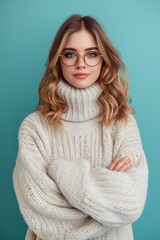 Sticker - Stylish pretty woman in glasses, wearing a warm and fashionable sweater, posing in a studio portrait.