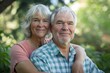 © osagvsa - Smiling Elderly Couple Embracing Outdoors