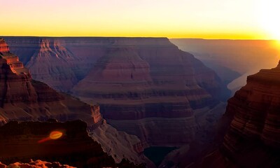 Poster - Sweeping view of Grand Canyon at sunset with rock formations bathed in golden light