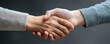 © khonkangrua - Close-up image of two hands shaking, symbolizing agreement, partnership, and trust between individuals in a business or personal setting.