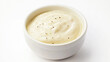 © Kraiwit - creamy Caesar dressing with a smooth, pale texture and flecks of Parmesan cheese