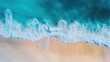 © Wahyu - Aerial View of Turquoise Ocean Waves Crashing on Sandy Beach