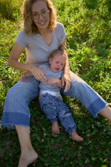 mother dresses toddler who screams, hates getting dressed