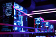© Studio Peace - Professional gaming computer with neon backlight with headset in the computer club for gamers.