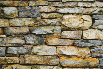 Many different size of rectangle brown grey stone wall for abstract background and texture for interior or exterior design. Beautiful patterns, space for work, banner, wallpaper close up.