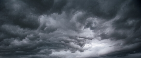 Aufkleber - The dark sky with heavy clouds converging and a violent storm before the rain.Bad or moody weather sky and environment. carbon dioxide emissions, greenhouse effect, global warming, climate change.