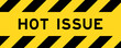 © bankrx - Yellow and black color with line striped label banner with word hot issue