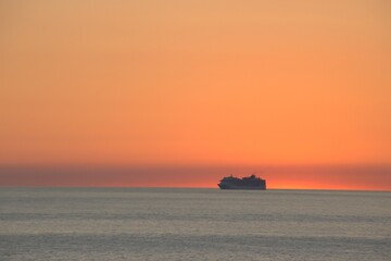 Canvas Print - Cruise ship at sunset off Bari coast