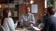 © somneuk - A manager guiding a team through a challenging project, with a focus on collaboration and decisive action