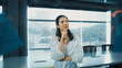 © InfiniteFlow - Beautiful female leader thinking about start up project in front of glass board. Smiling young project manager looking at colorful sticky notes with show creativity marketing strategy. Manipulator.