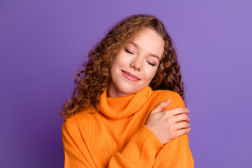 Wall Mural - Portrait of lovely young girl closed eyes touch shoulder wear sweater isolated on purple color background