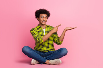 Sticker - Full length portrait of nice young man point finger hold empty space wear shirt isolated on pink color background