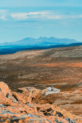 Wall Mural - Rocks and a view from a trip to the Muen Mountain, Innlandet, Norway, in late summer.