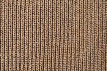 Poster - Texture of brown knitted fabric as background, top view