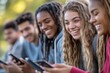 © Lux Images - Diverse Group of Friends Enjoying Time Together on Their Smartphones