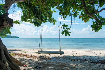 Tranquil beach paradise with swing between trees overlooking a crystal lagoon