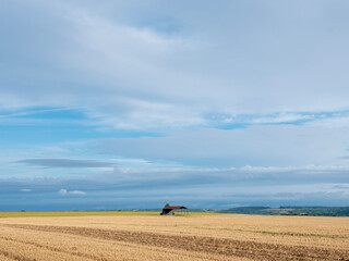 Wall Mural - wide landscape with typical open barn of france north