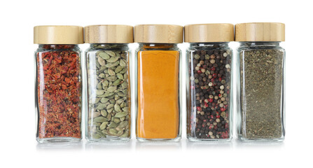 Wall Mural - Different spices in glass jars isolated on white