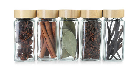 Poster - Different spices in glass jars isolated on white