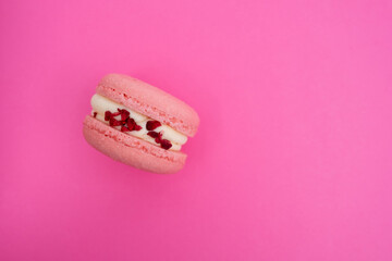 Macarons on a colored background, French cookies. Gift for March 8, International Women's Day, Valentine's Day. Sweets for coffee and tea