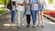 © Prostock-studio - Cropped of teen international friends hugging and walking by street, back view, friendship concept