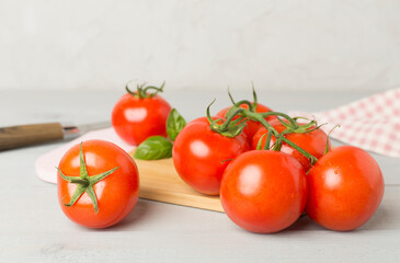 Fresh tomatoes on wooden background