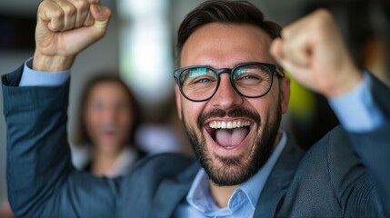 Poster - A man with glasses is smiling and raising his hands in the air