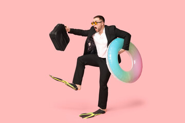 Sticker - Shocked office worker in flippers with inflatable ring and briefcase on pink background