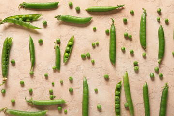 Wall Mural - Green peas on beige background