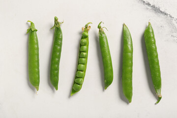 Wall Mural - Green peas on light background