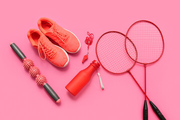 Wall Mural - Sneakers and sports equipment on pink background