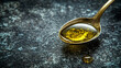 © Your Hand Please - hand pouring olive oil from a bottle into a spoon in a kitchen setting. The image emphasizes the natural flow of the oil, representing health, wellness, and culinary preparation