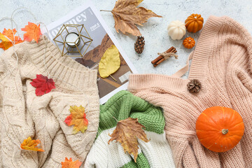 Canvas Print - Composition with stylish warm sweaters, magazine and autumn decor on light background