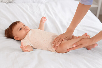 Poster - Cute little baby getting massage on bed