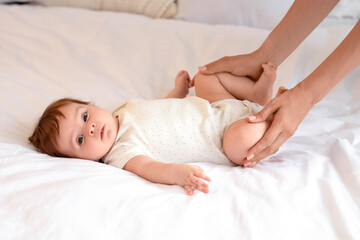 Sticker - Cute little baby getting massage on bed